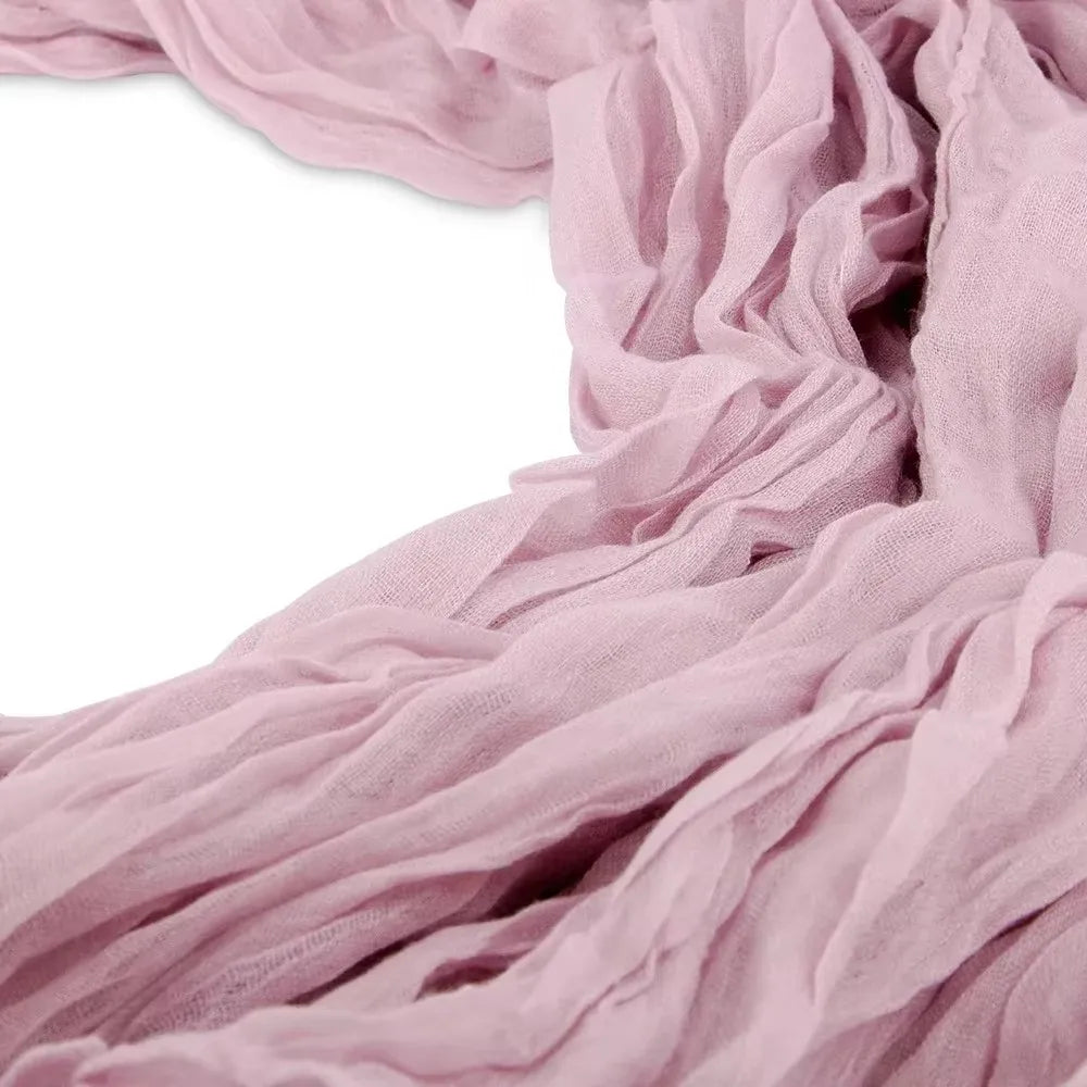 Soft dusty pink cotton gauze table runner draped in flowing folds