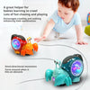 An interactive crawling crab toy with music and lights is shown on a white floor, encouraging babies to learn to crawl.