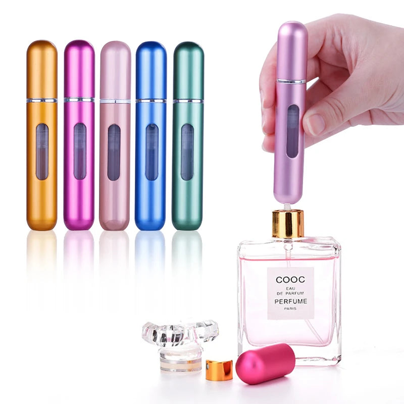 A hand holds a set of five colorful, travel-friendly refillable perfume spray bottles with gold and iridescent finishes.