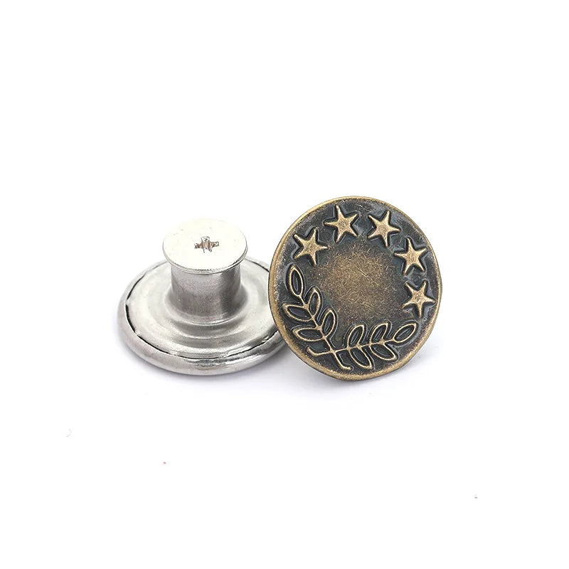 A round, antique brass button with five stars and a wreath design, shown next to its silver mounting base.