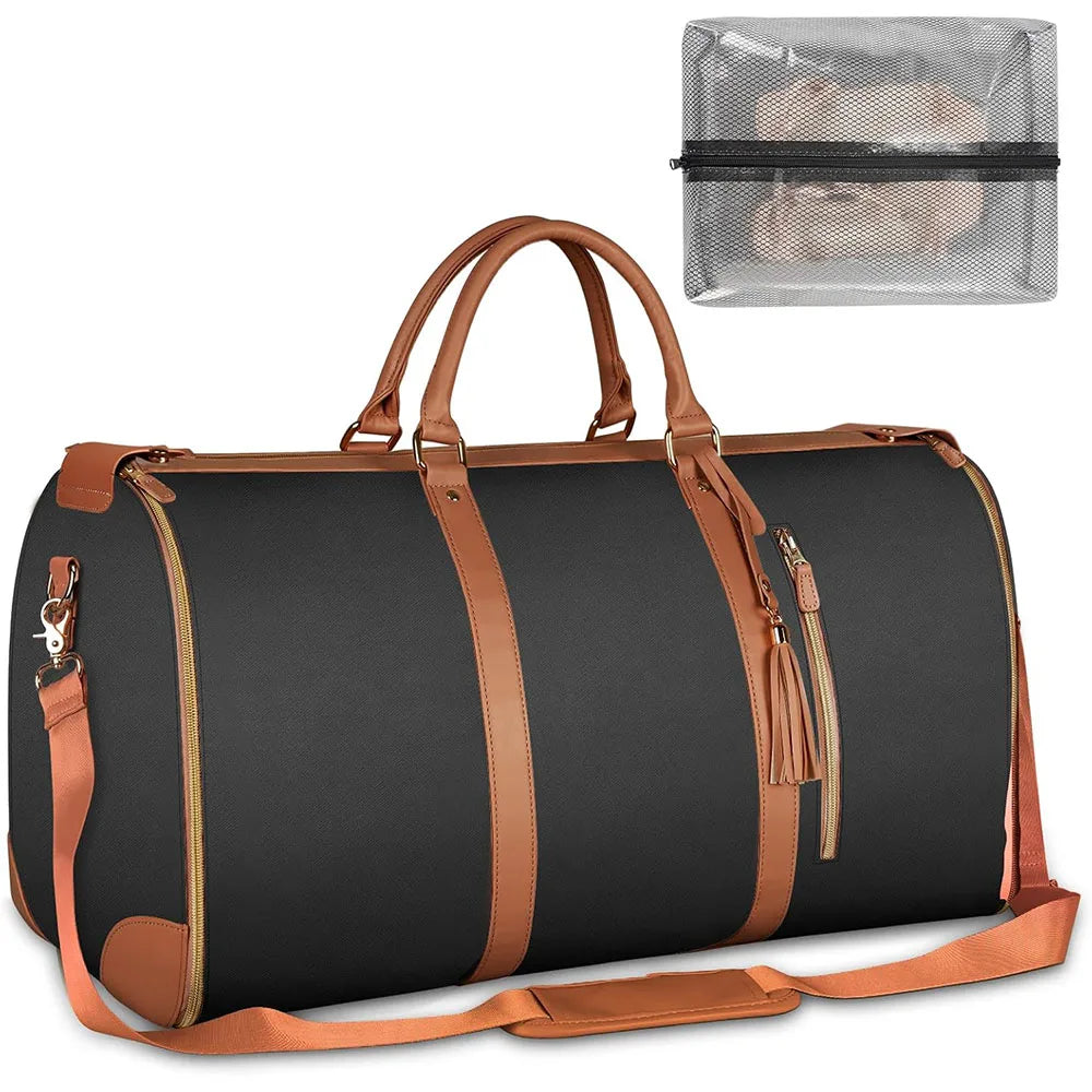 A dark gray duffel bag with brown leather accents and a clear mesh shoe pouch attached.