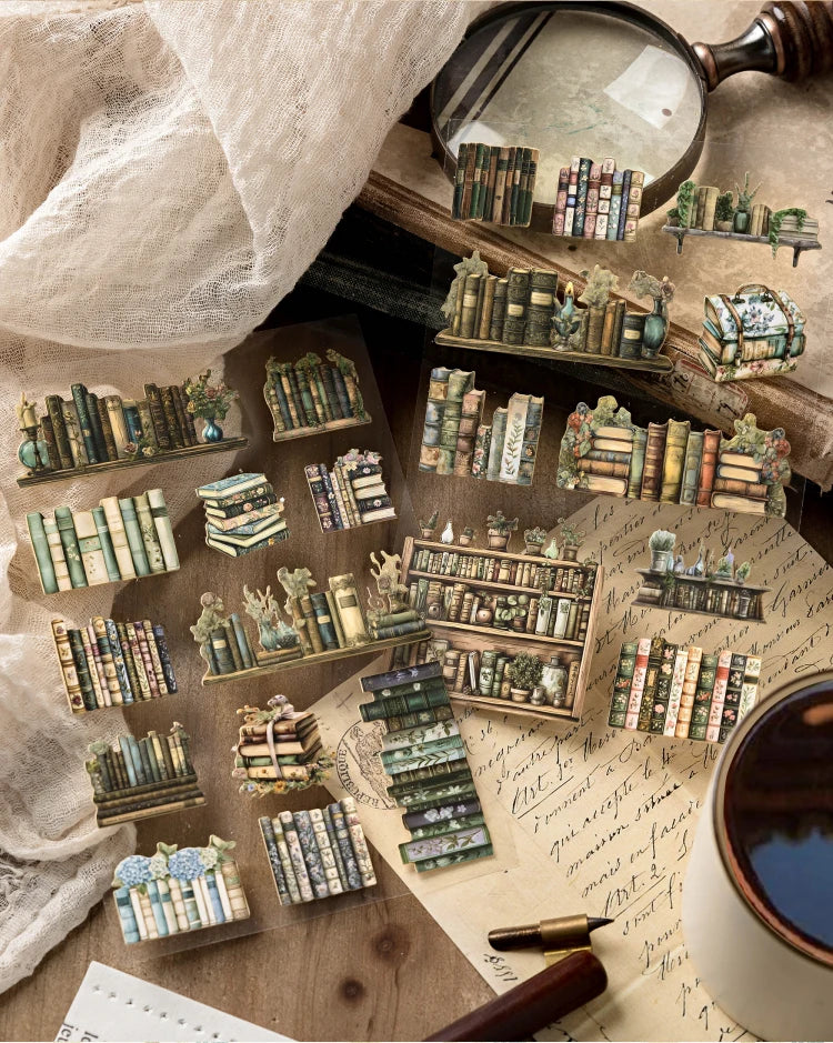 A collection of die-cut stickers and miniature books arranged on a wooden surface with a magnifying glass.