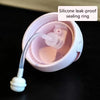 A silicone leak-proof sealing ring is shown inside a pink cup with handles.