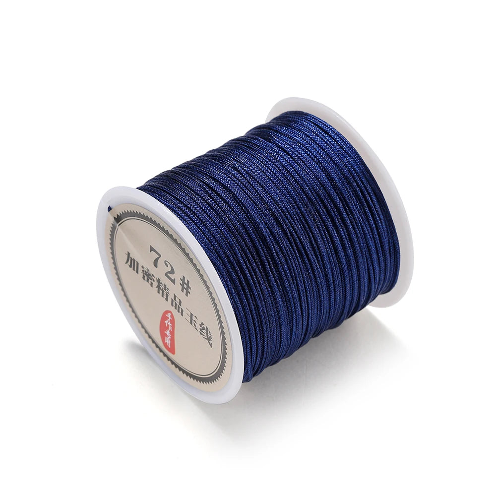 Spool of dark blue 0.8mm nylon macramé cord for jewelry making