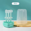 A blue silicone toothbrush set with a storage case and tongue cleaner displayed on a yellow surface.