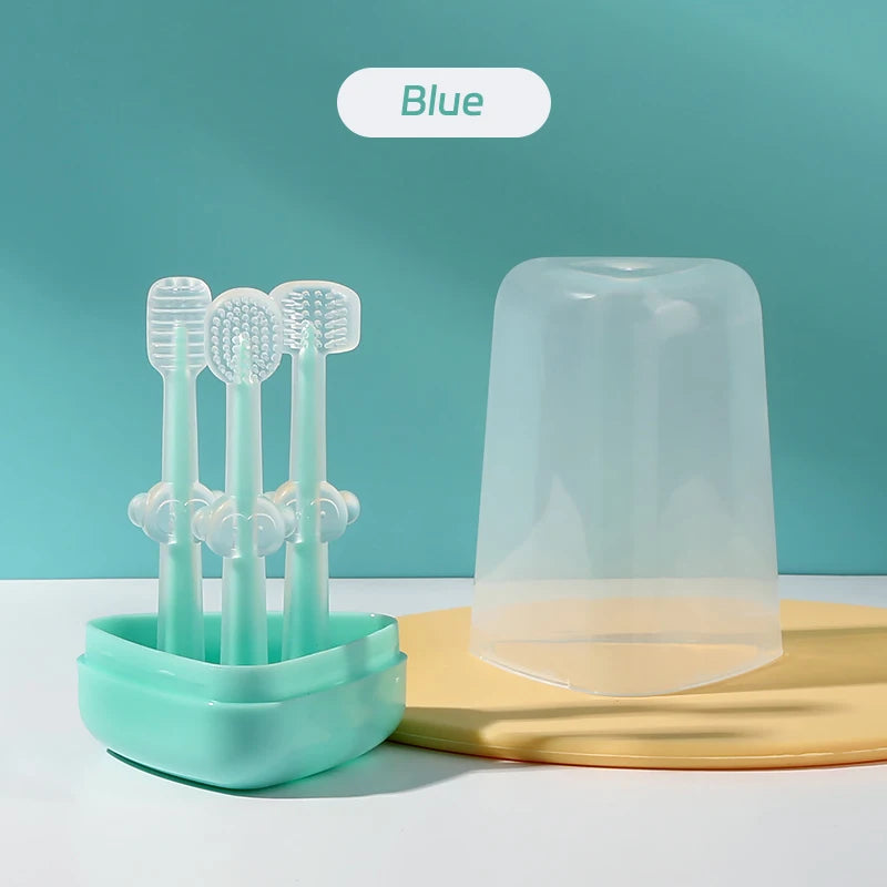 A blue silicone toothbrush set with a storage case and tongue cleaner displayed on a yellow surface.