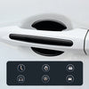 A close-up view of a white car door handle with a black protective film applied, showing various icons for features.