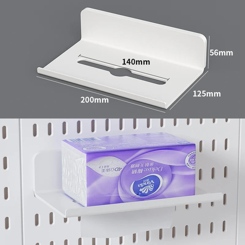 A white desktop pegboard organizer with shelves and hooks is shown in a close-up view.