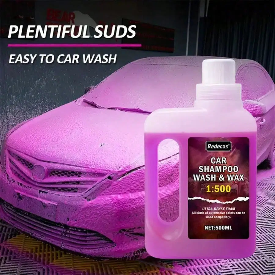 Pink foam car shampoo wash and wax product bottle with a purple car surface in the background