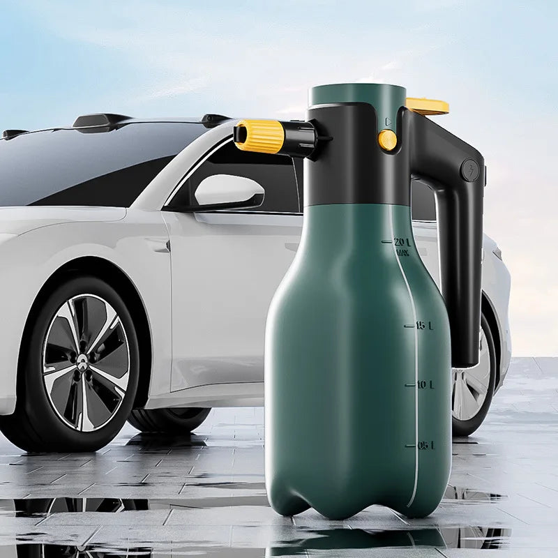 A green cordless electric foam sprayer bottle is positioned in front of a white car.