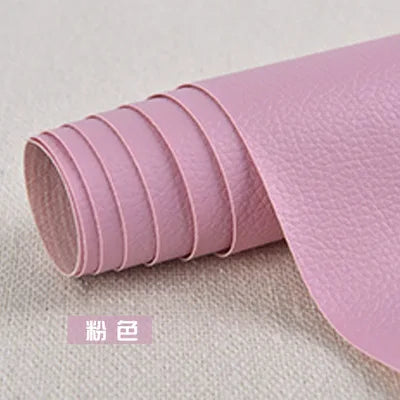 Roll of pink self-adhesive PU leather patch for furniture and craft repairs