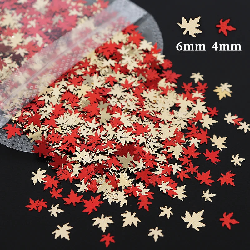 A pile of red and gold holographic star sequins for resin crafts, showing various sizes.