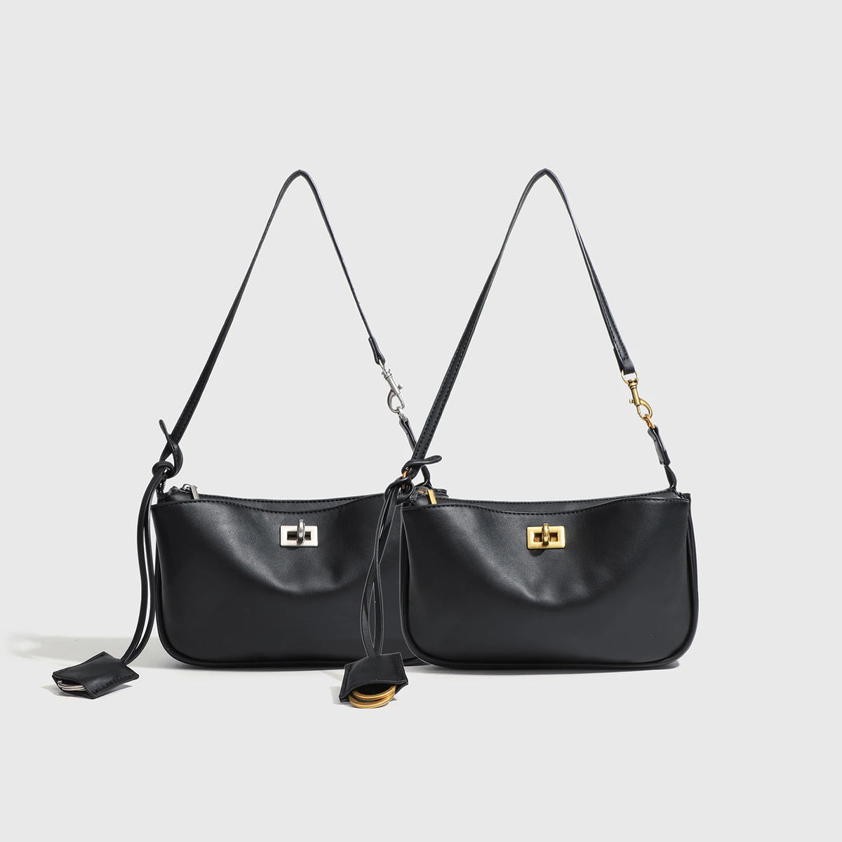 Black classic leather tote bag with gold-tone metal buckle and long straps