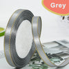 Roll of grey satin ribbon with gold edge for crafts and gift wrapping