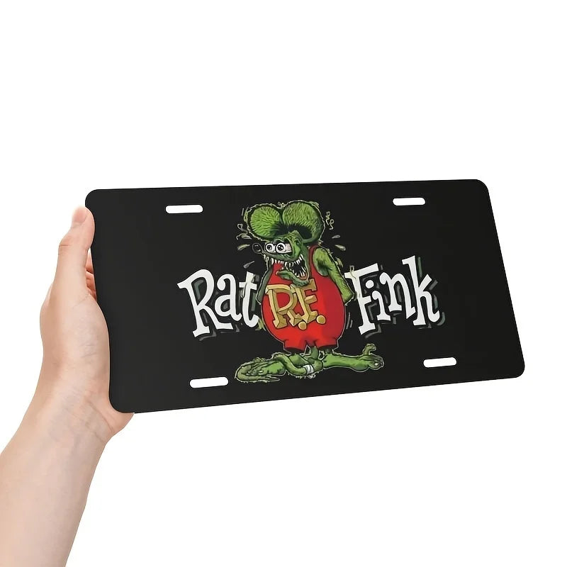 A black aluminum license plate sign featuring a vintage Rat Fink illustration with red and green tones.