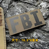 A dark olive tactical morale patch featuring the embroidered letters FBI on a rough stone background.