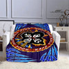 A purple and blue flannel throw blanket featuring a graphic design of the Kiss band logo.