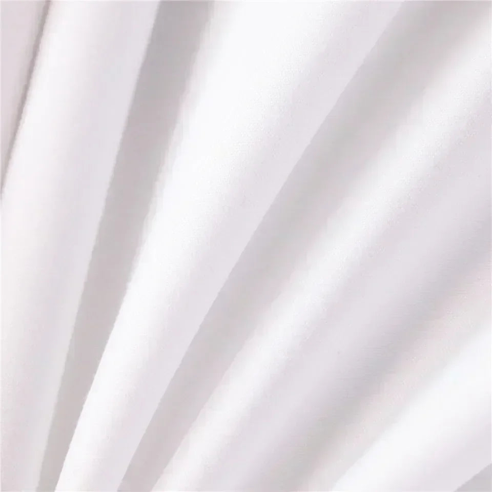 White fabric draped in soft folds showing subtle shadows