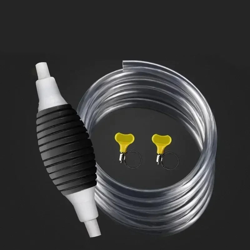 A clear plastic siphon pump with a white nozzle and yellow transfer funnels is shown against a dark background.