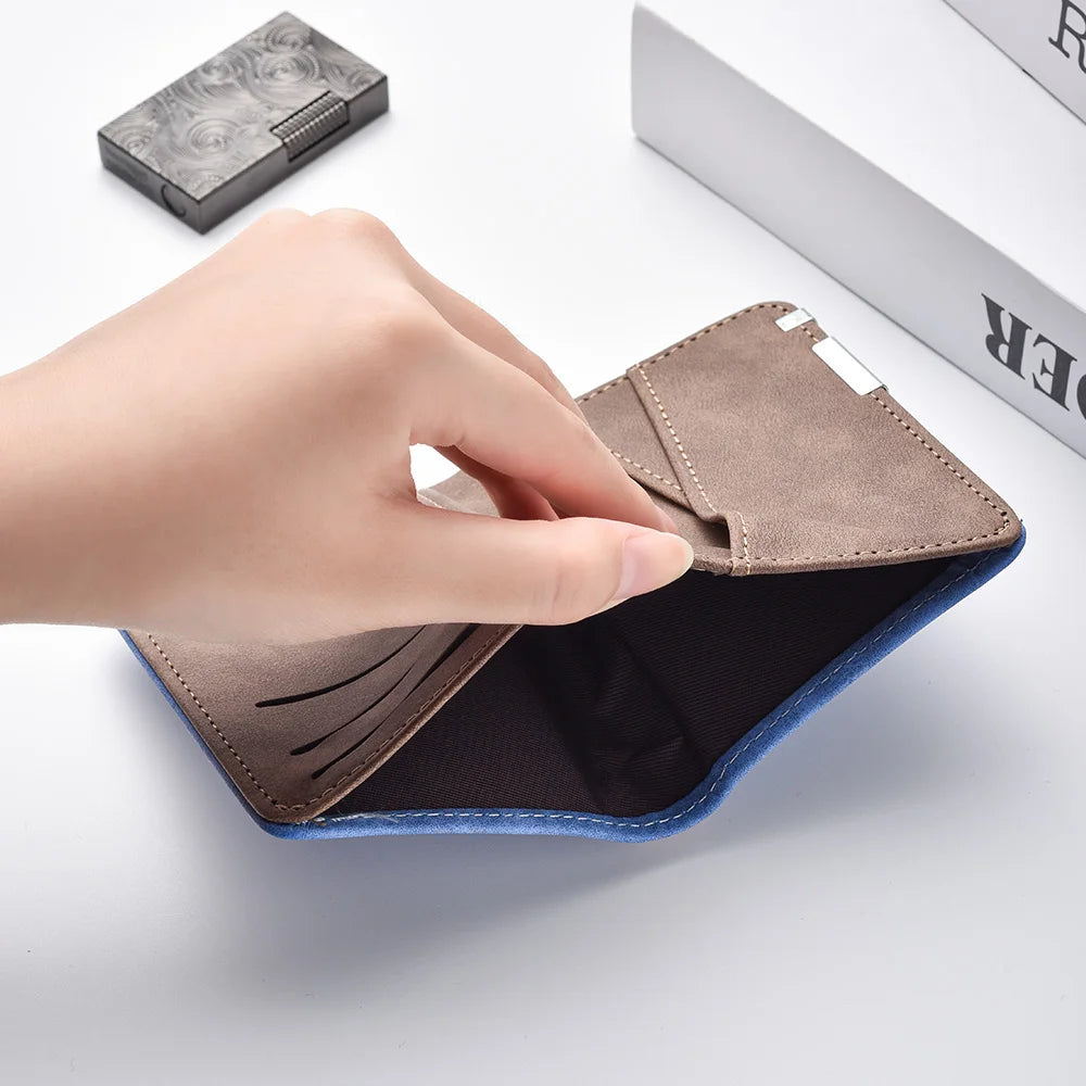 A hand opens a brown leather compact double-fold wallet with blue accents on a white surface.