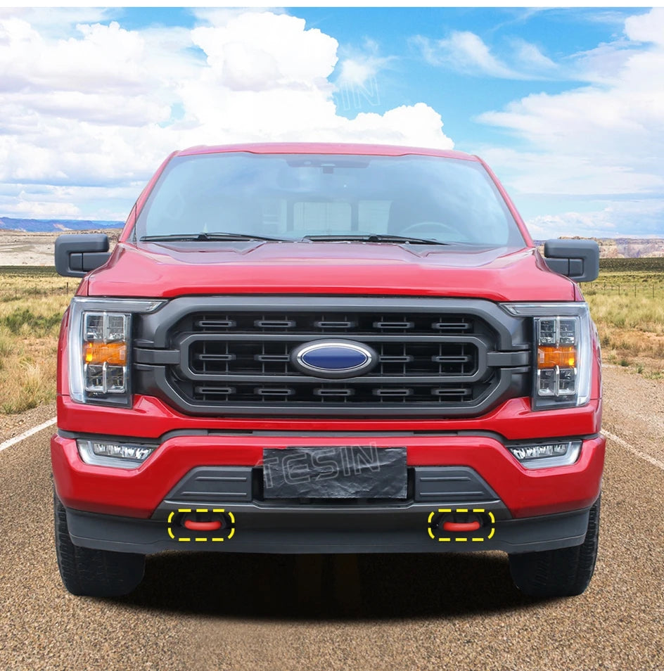 Red TPE front bumper tow hook cover for a Ford F-150 truck.