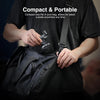 A person holds a compact magnetic phone holder for gym workouts inside a black bag.