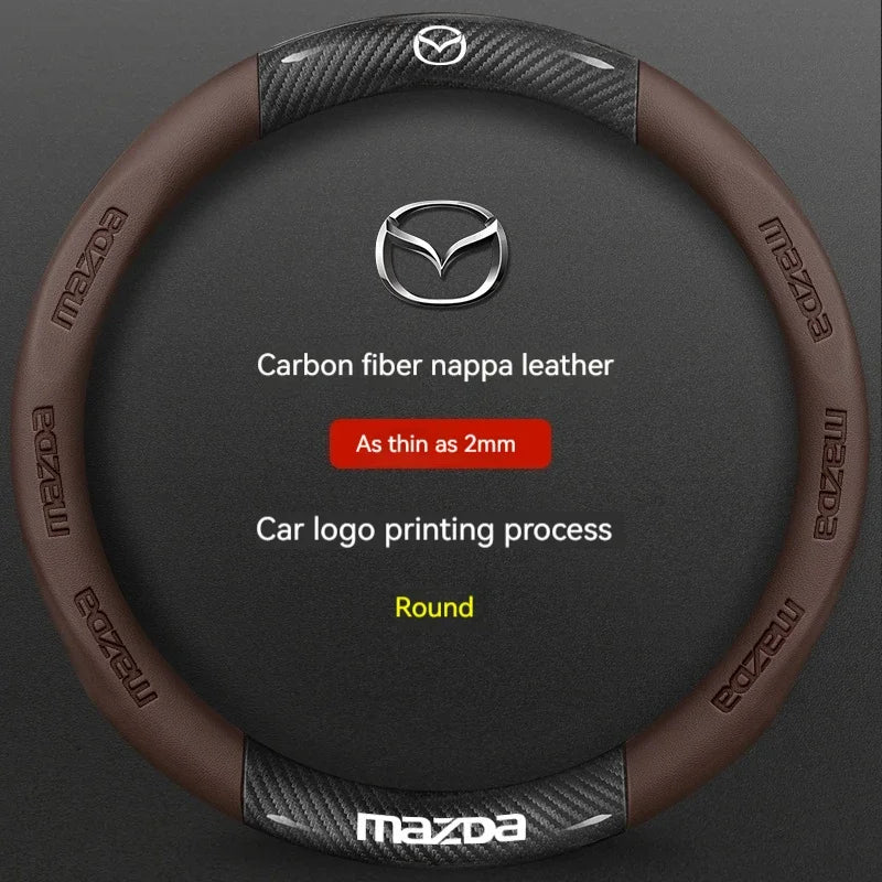 A brown carbon fiber and leather steering wheel cover for a Mazda vehicle.