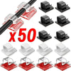 A set of 50 black adhesive cable organizer clips for desk and home use.