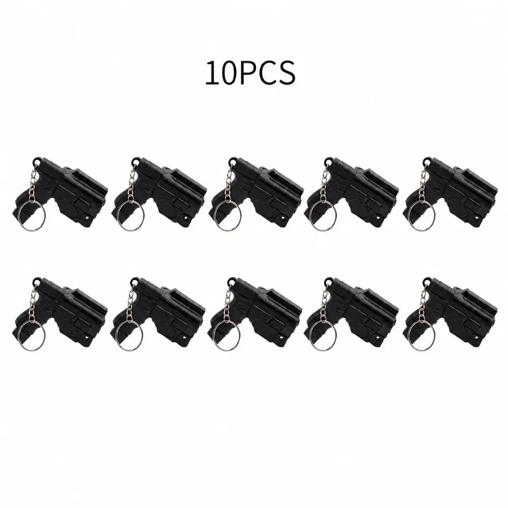 A set of ten black mini pistol-shaped keychain accessories.