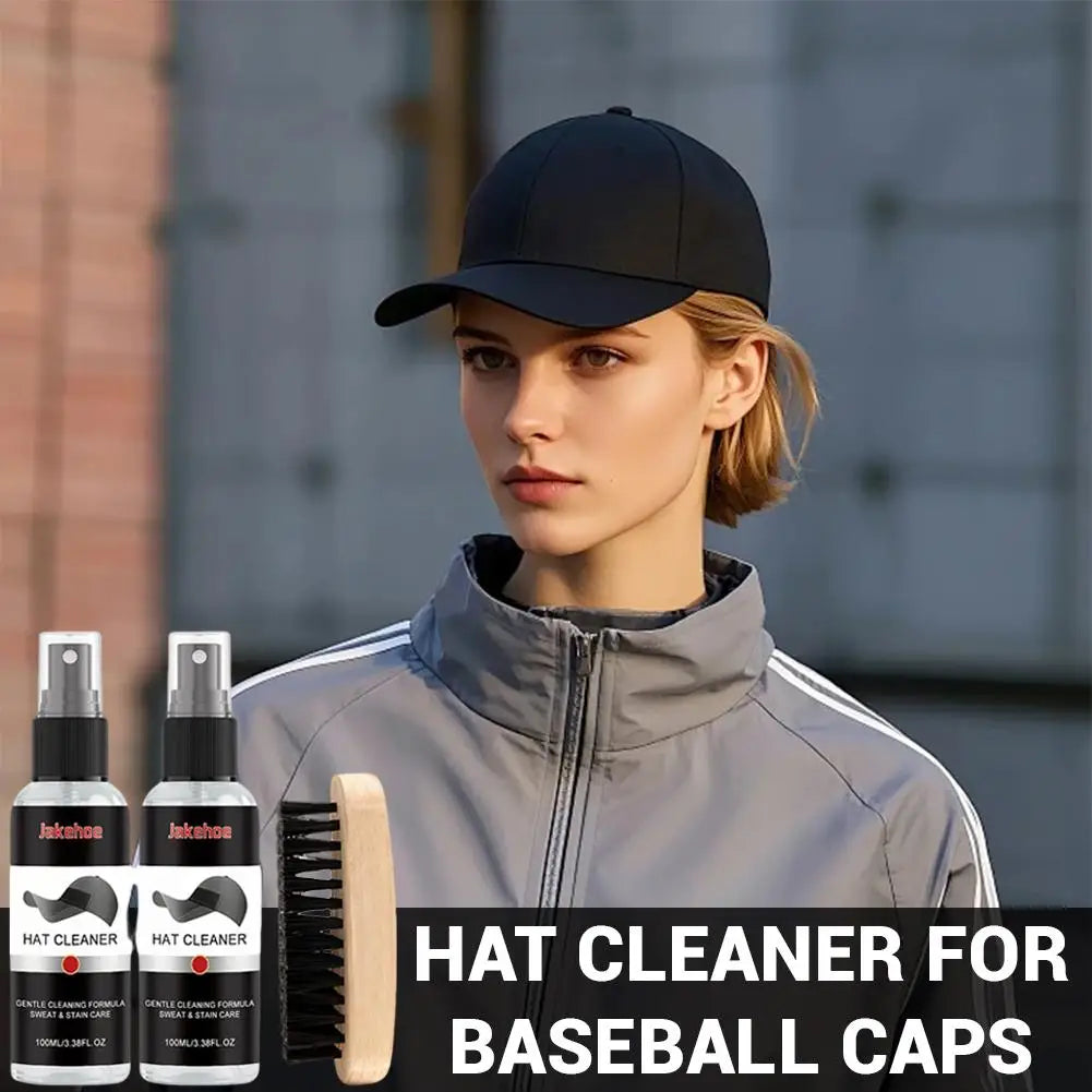 A model wearing a black baseball cap is shown next to a complete hat cleaning kit with a brush and two spray bottles.