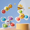 A collection of colorful, ocean-themed spinning bath toys with various shapes and colors displayed against a light blue backg