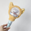 A plush cat-shaped cover for a SEVENTEEN official light stick is held in a hand.