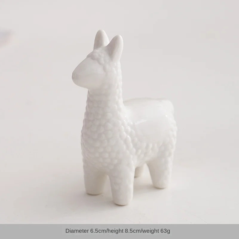 White ceramic figurine of a rabbit with textured body and long ears.