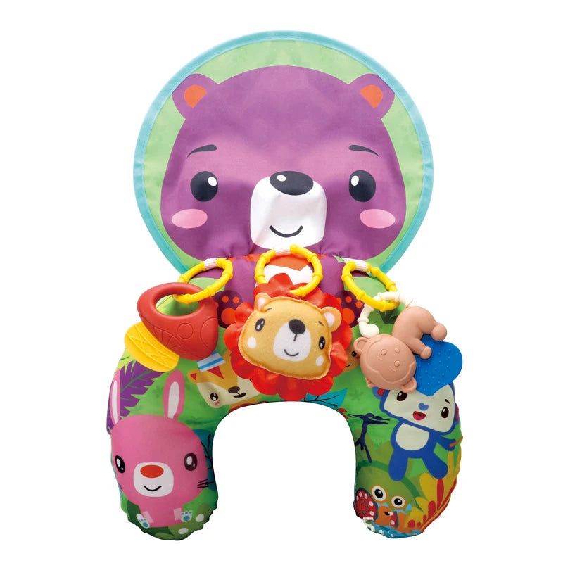 A colorful high contrast tummy time pillow featuring various animal faces like a purple bear and other cute characters.