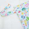 A light blue and colorful patterned mini waterproof wet dry bag for baby with a zipper.