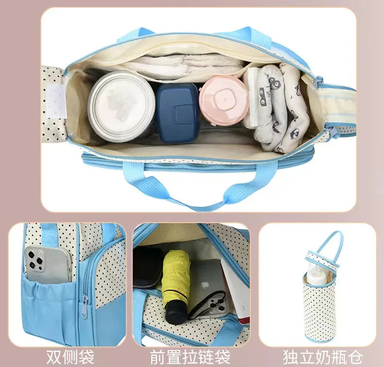 A light blue multifunctional diaper bag set featuring a main compartment and an attached zippered pouch.