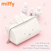 A white Miffy cartoon rabbit cosmetic bag with a zipper and a small charm, shown on a pink background.