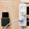 A white removable adhesive hook dispenser with multiple hooks is shown next to a black device and a white cord.