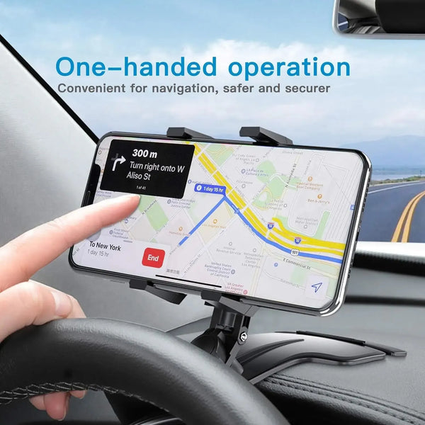 A hand operates a dashboard phone mount displaying a navigation map on a smartphone inside a car.