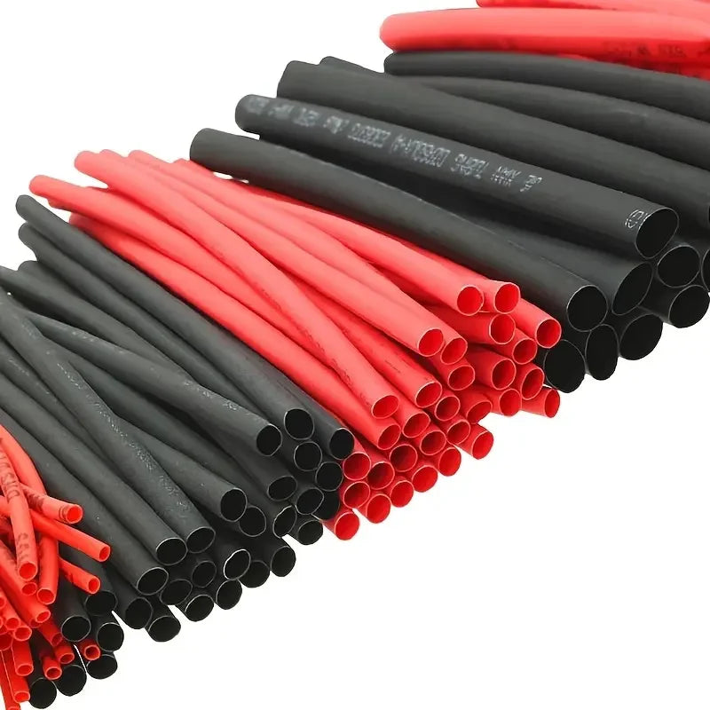 Assortment kit of 127 heat shrink tubing in red and black colors arranged in a row.