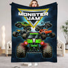A dark blue blanket featuring a graphic of monster trucks under a yellow shield logo.
