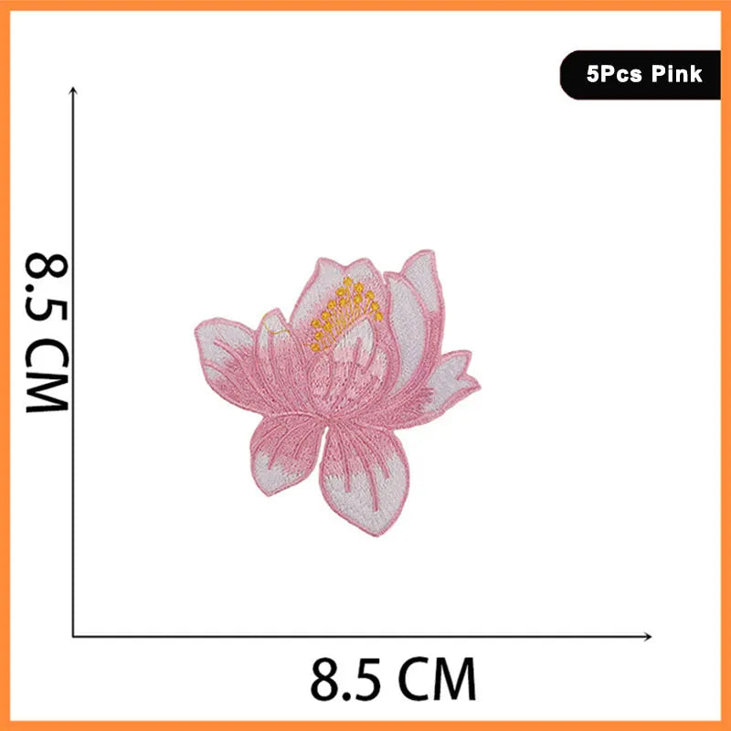 Pink embroidered flower patch resembling a rose or butterfly, measuring 8.5 cm wide.