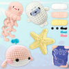 A beginner crochet kit featuring various yarn colors and a finished pink and white animal amigurumi project.