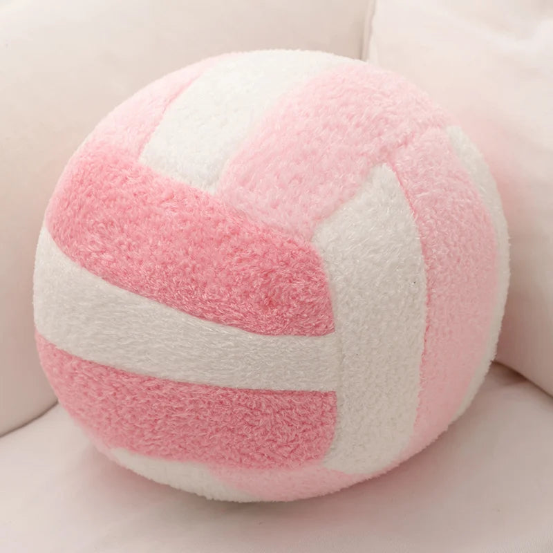 A pink and white striped simulation volleyball plush toy pillow.