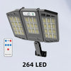 A black outdoor wall light fixture with 264 LEDs and a remote control is shown against a light gray background.