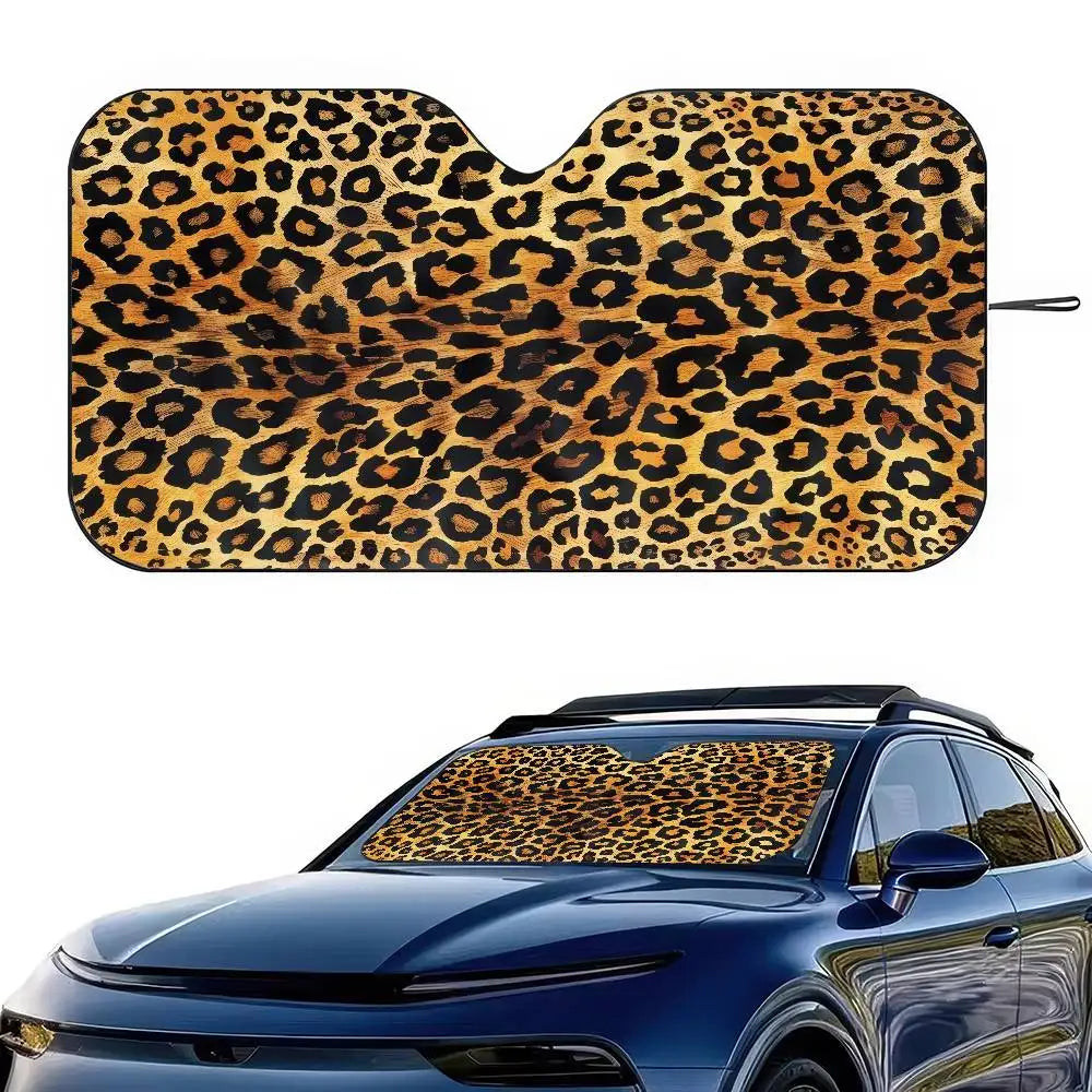 Leopard print car windshield sunshade placed on a blue car.