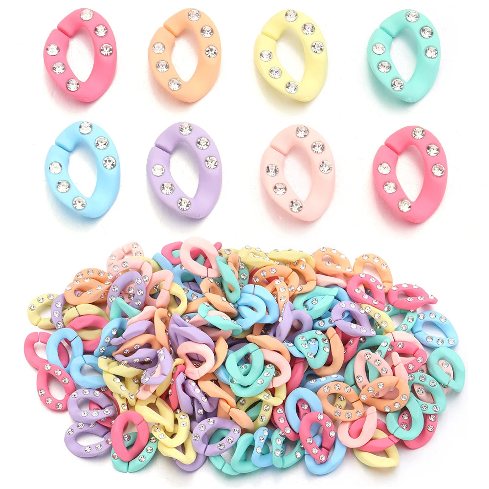 A pile of 20 acrylic jewelry connector clasps in various pastel colors including pink, purple, yellow, and blue with crystal 