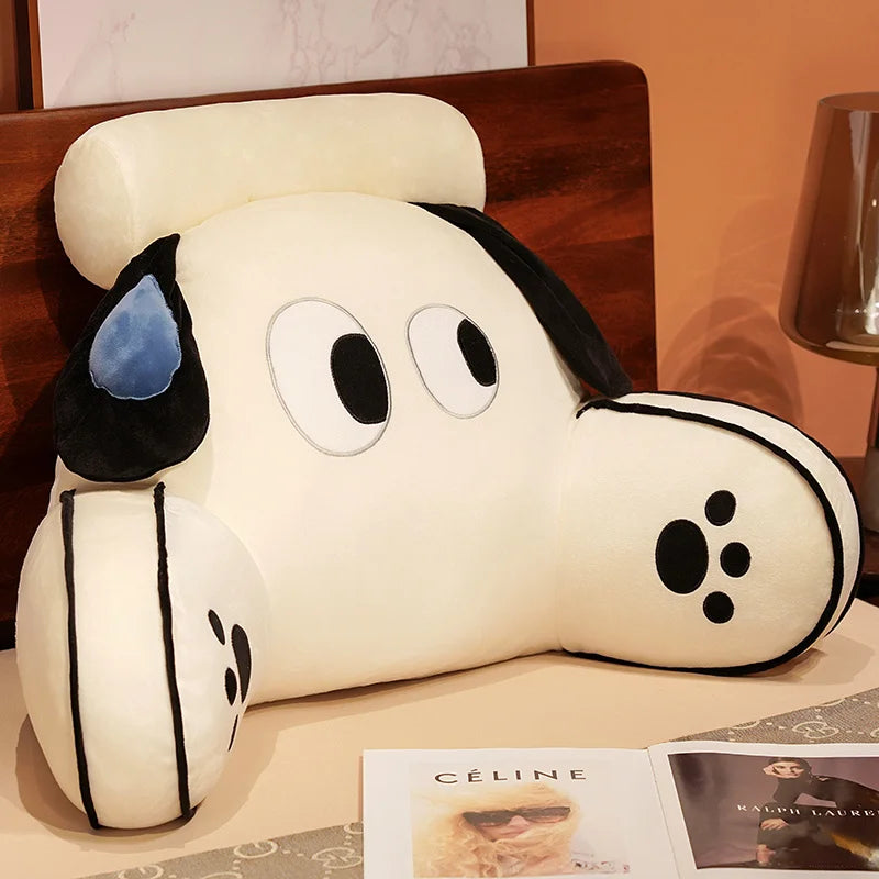 A white plush cat and dog backrest cushion resting on a wooden surface.