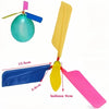 A yellow propeller balloon helicopter toy with a blue and pink whistle attached.