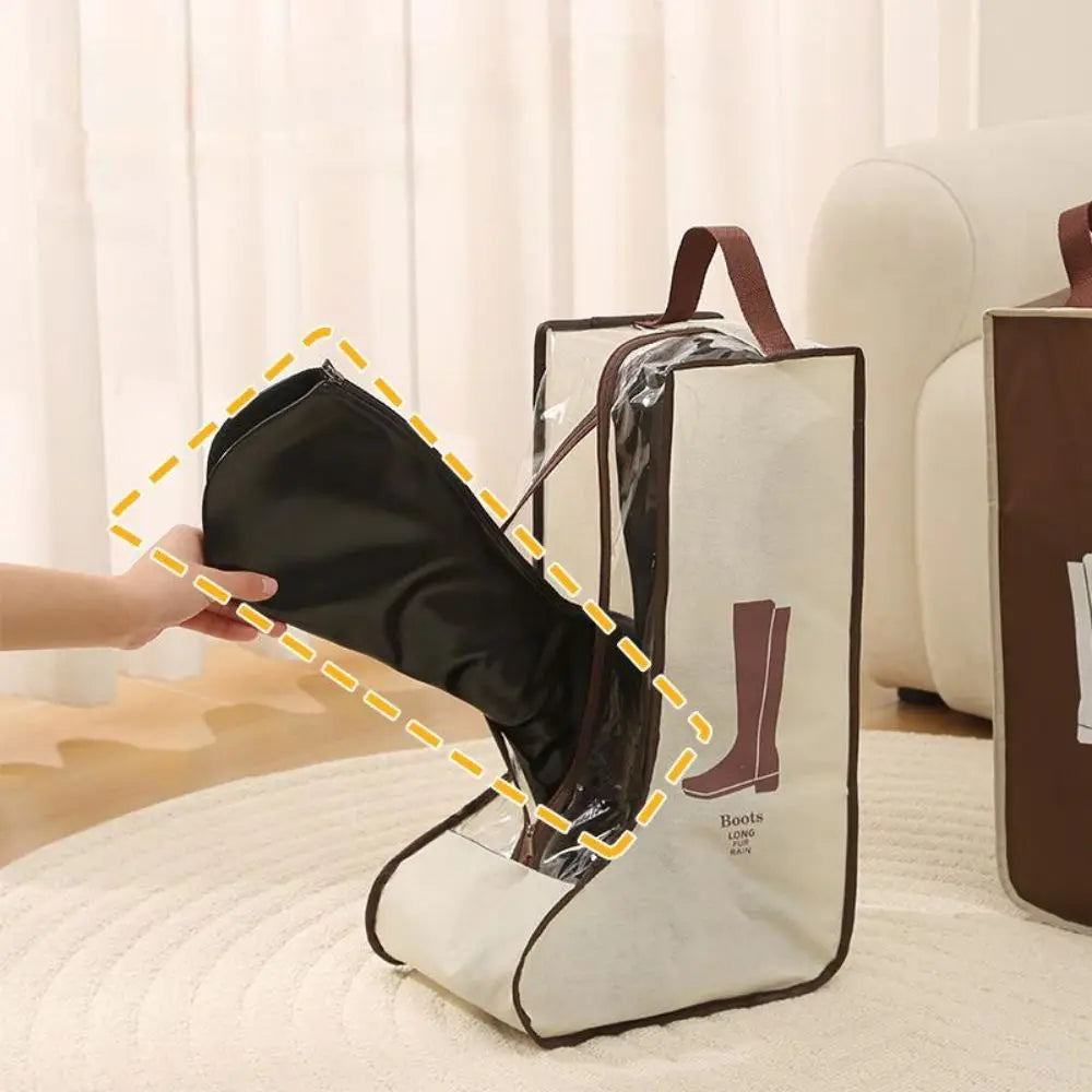 A hand is placing a black tall boot into a white storage bag with brown straps.